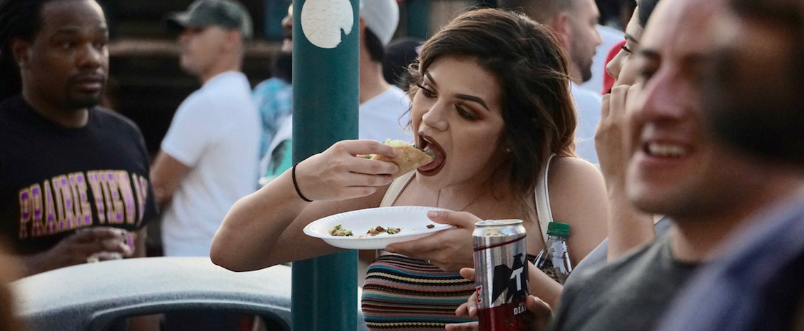 woman eats taco