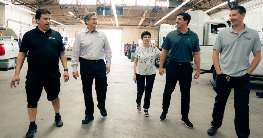 people walking in a auto shop