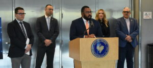 man speaking at podium