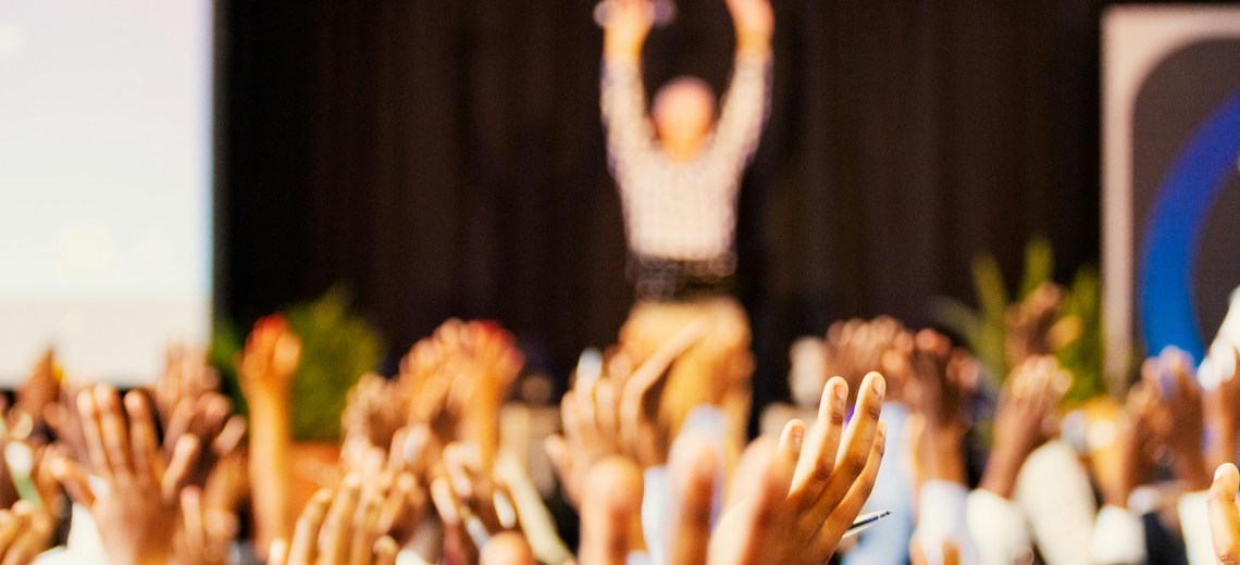team raising hands