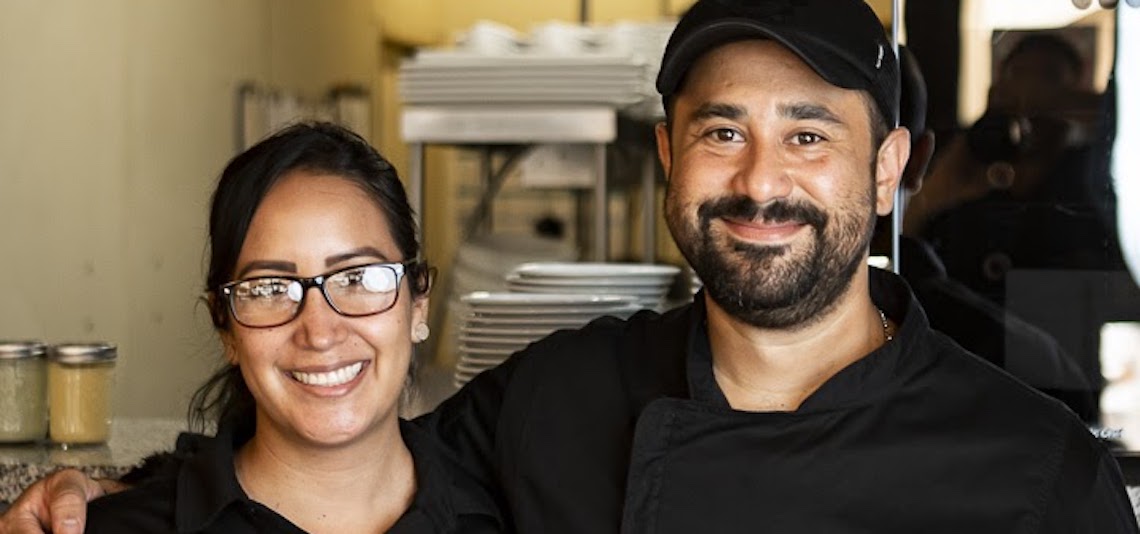 man and woman smiling