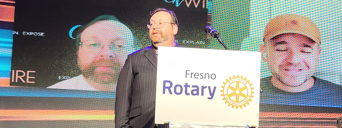 man standing at podium