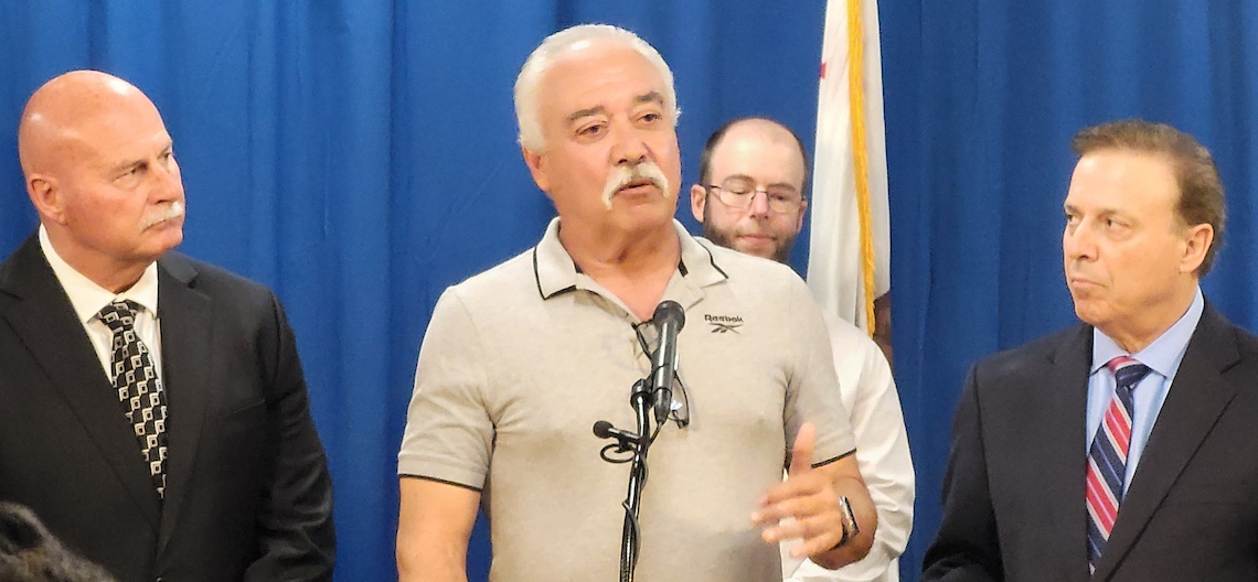 man speaking at a podium