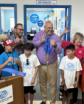 people cutting a ribbon