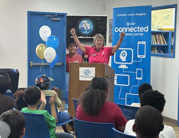 woman celebrating at a podium