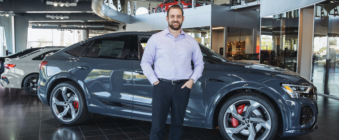 man in front of car