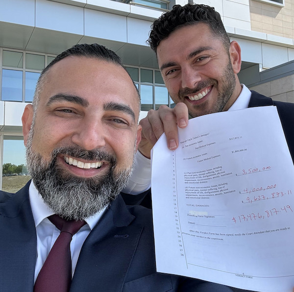 two men with a paper