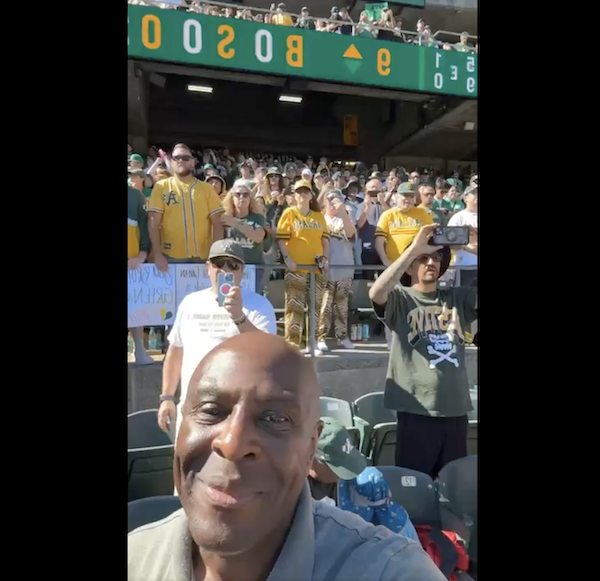 man smiling in stadium