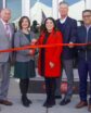 people ready to cut a ribbon