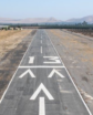 air field runway with hills in distance