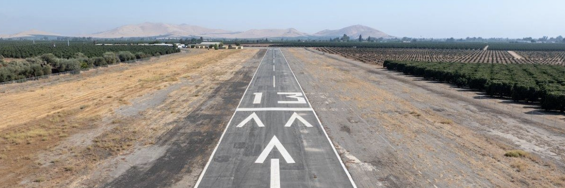 air field runway with hills in distance