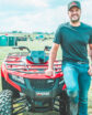 man smiling on atv