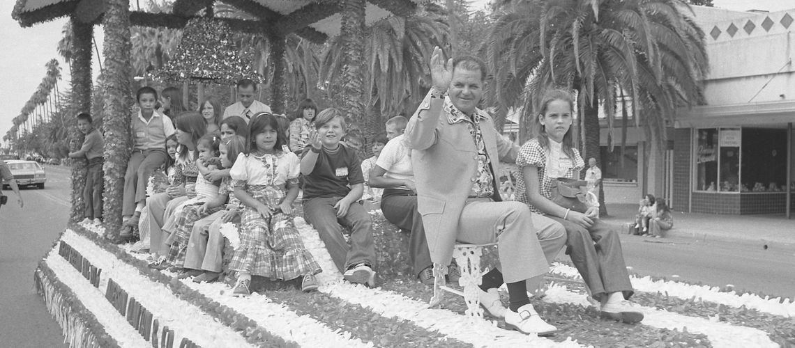 man and children on a float