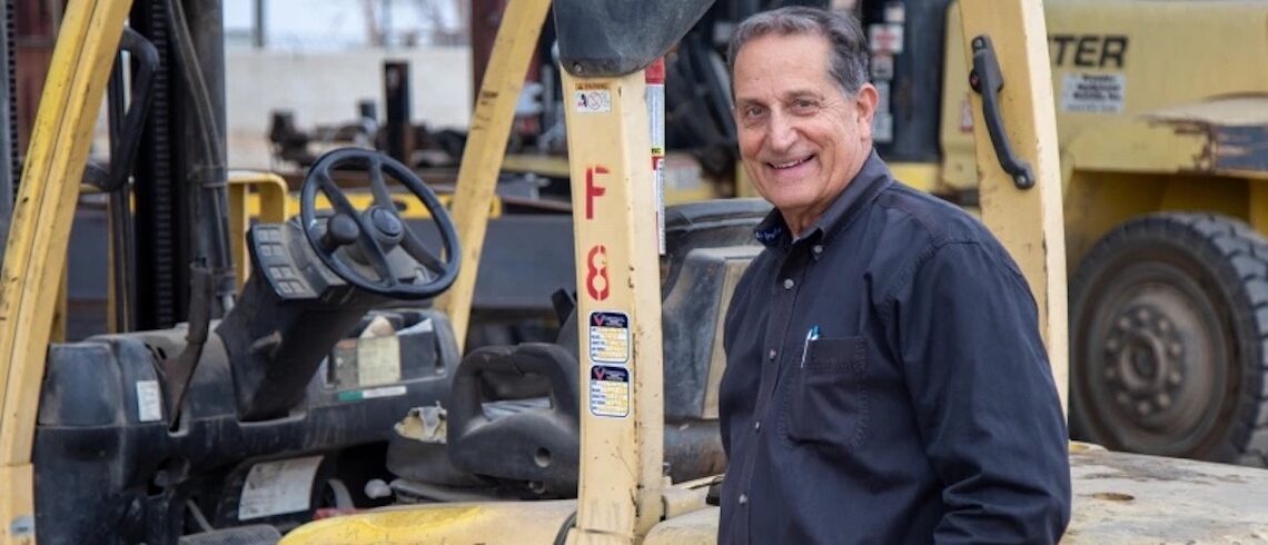 man in front of machinery