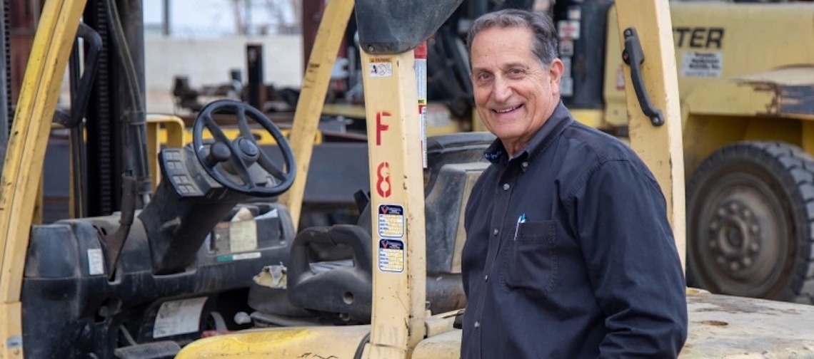 man in front of machinery