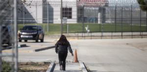 woman walks to prison