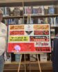 man and woman pose with farm labor bumper stickers