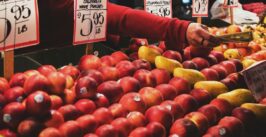 fruit stand vendor reach out to offer change