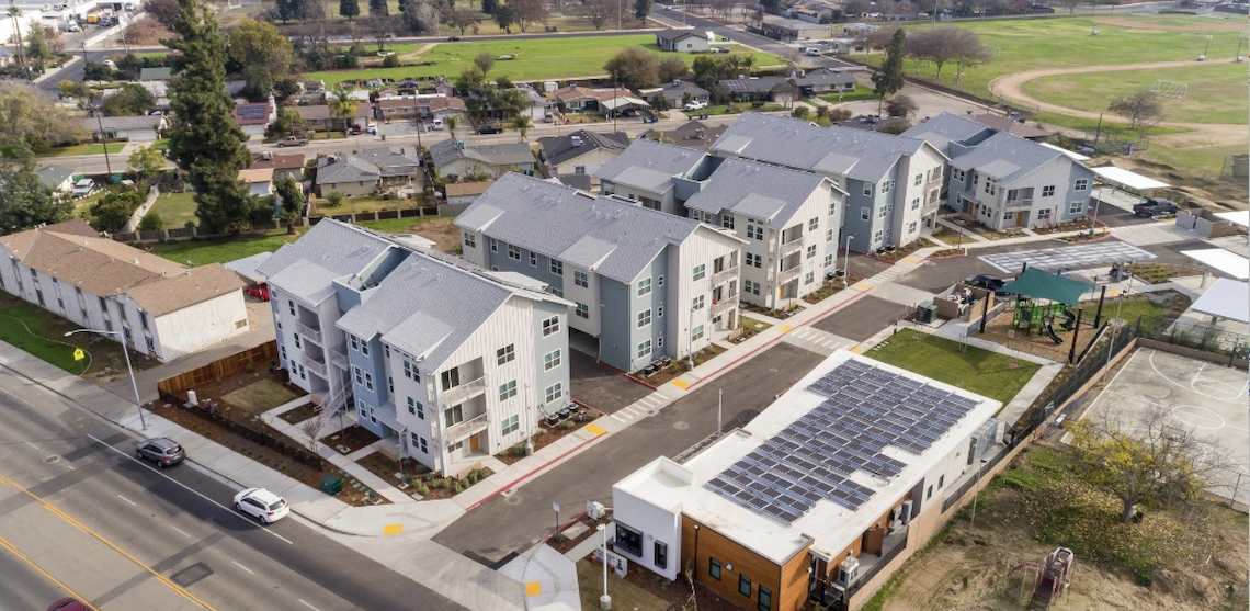 aerial view of an apartment complex that is modern