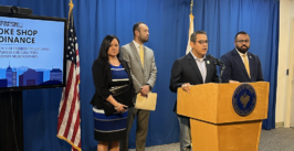 man speaks at podium