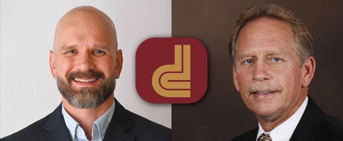 two men with a d logo between
