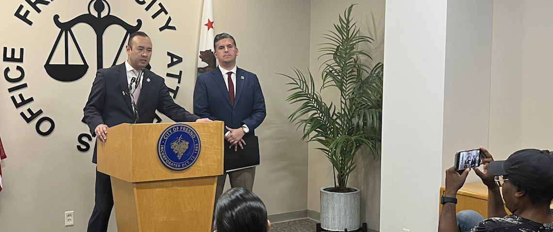 two men at a news conference