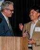 man getting an award at a podium