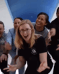women in front of the camera doing jazz hands
