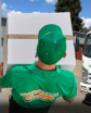 photo illustration with a man crossing his arms, another man carrying a box and a moving truck