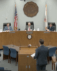 elected officials on a dais