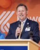 man speaking at podium