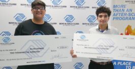 two boys with oversized check