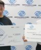 two boys with oversized check