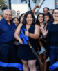 a woman cuts a ribbon