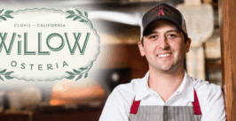 man with a restaurant logo