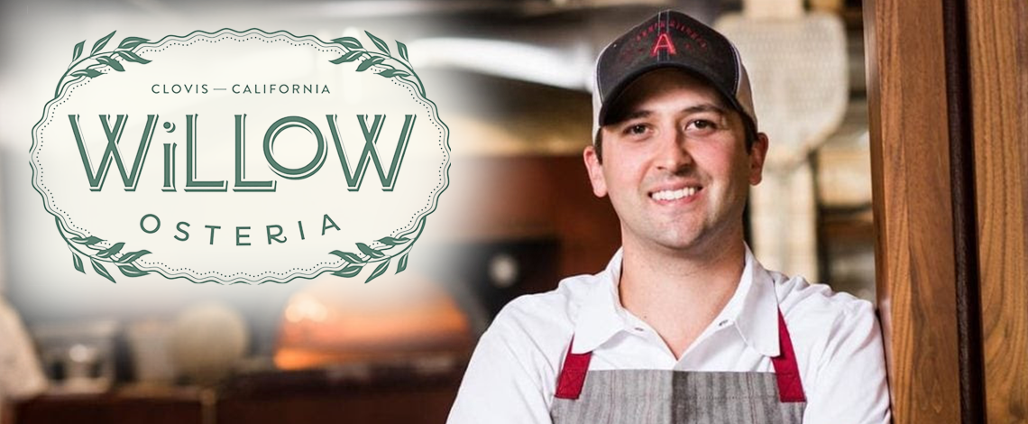 man with a restaurant logo