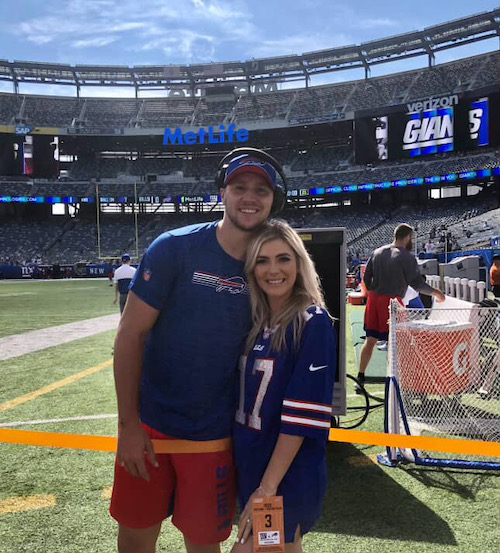 a man and woman on a football field