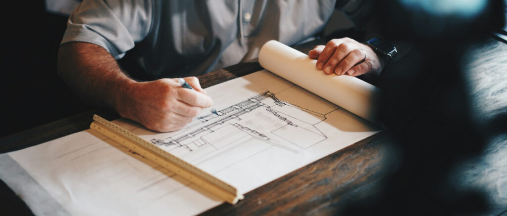 architect drafting on paper