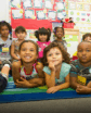a man's picture next to young children