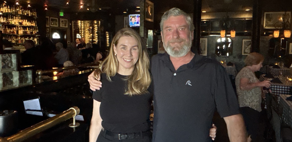 two people in a bar