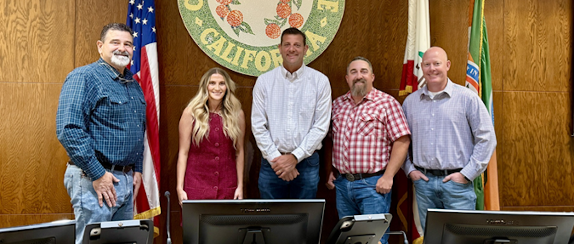 group of people on a city government dais