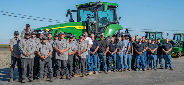 tractor with people posed in front