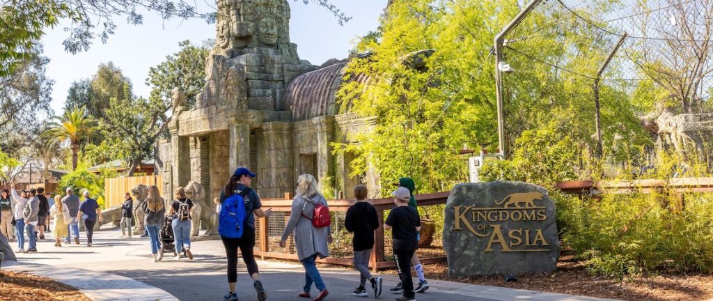 zoo exhibit with children walking by