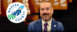 man with madera county logo