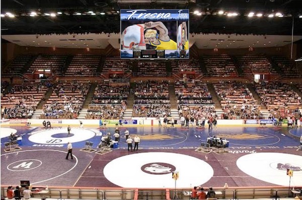 overhead scoreboard of an arena configured for wrestling