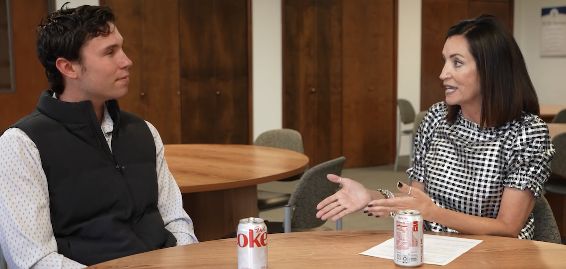 two people speaking to one another