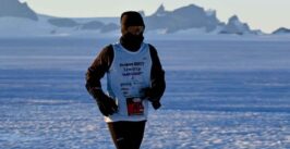 a man runs in sub-zero temperatures in an icy wasteland