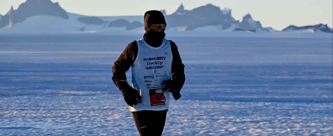 a man runs in sub-zero temperatures in an icy wasteland
