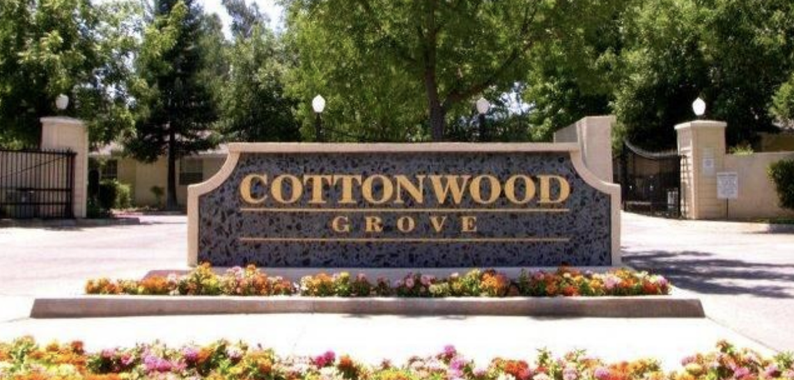 monument sign for an apartment complex called cottonwood grove