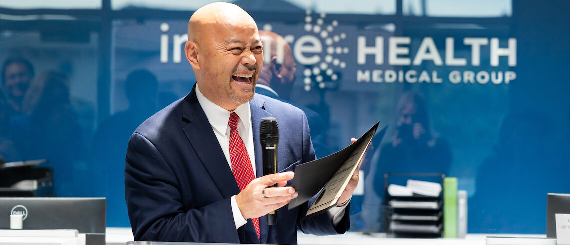 man speaking at a podium